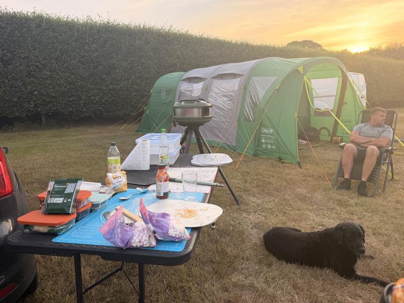  Family enjoying the pizza in the sun